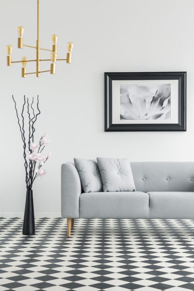 plant next to grey couch in living room interior w C8DYWFP
